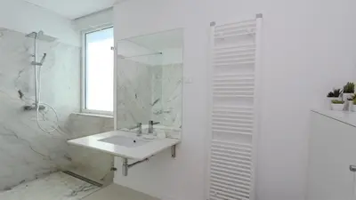 a white bathroom with a sink and a mirror at Villa Terese-CleverDetails, Central Vilamoura, Sleeps 6, luxury, walking distance in Vilamoura