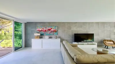 a living room with a couch and a tv at Villa Terese-CleverDetails, Central Vilamoura, Sleeps 6, luxury, walking distance in Vilamoura