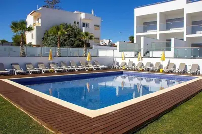 a swimming pool in front of a building at Villa beautiful View over the sea - T in Albufeira