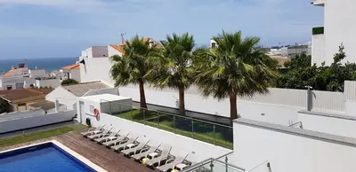a house with a swimming pool and palm trees at Villa beautiful View over the sea - T in Albufeira
