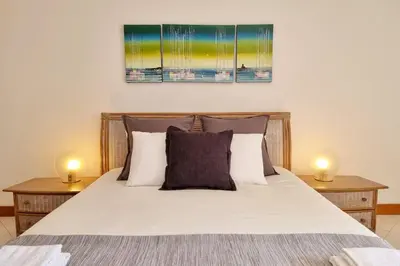 a bedroom with a bed with two lamps on it at Tivoli Apt8 with Pool&Garage in Vilamoura