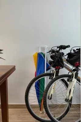a bike parked next to a group of flags at The Albufeira Concierge - Villa Balaia Sun Terrace in Albufeira