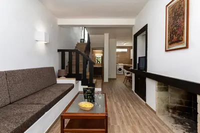 a living room with a couch and a table at The Albufeira Concierge - Villa Balaia Sun Terrace in Albufeira