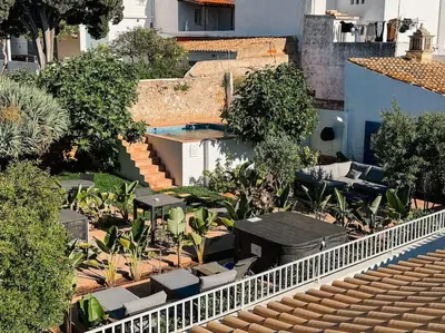 an overhead view of a patio with tables and chairs at Old Fisherman's Corner 18 - Centro Old Town Albufeira in Albufeira