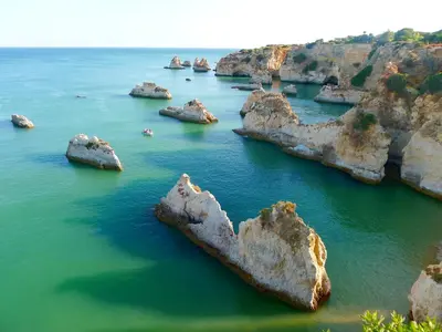 an aerial view of rocks in the water at Charming House with Pool in Faro in Faro