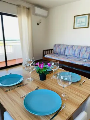 a bar with tables and chairs in a restaurant at Casa Do Canto in Albufeira