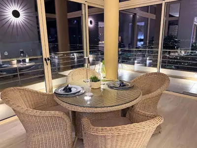 a view of a city lit up at night at AlbufeiraOrada SunSet Penthouse by Be Cherish in Albufeira