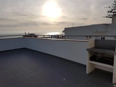 a balcony with a bench on top of a building at Villa Amazing View - S in Albufeira
