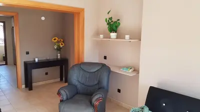 a living room with a couch and a table at Algarve Paraíso / Golf Vila Sól in Quarteira