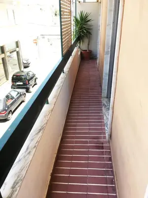 a stairway in a building with a window at Lemon Tree Apartments in Faro
