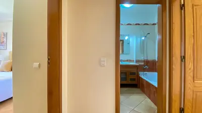 a shelf with three signs on a wall at T3 Marina Sol Vilamoura by HsRentals in Vilamoura