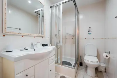 a bedroom with two beds and a window at Apartamentos Julieta in Albufeira