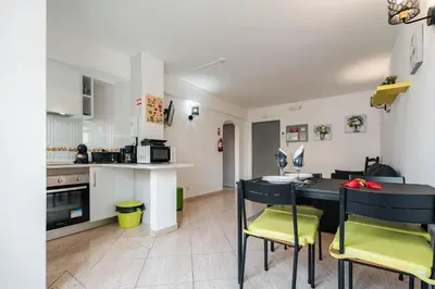 two beds sitting next to each other in a bedroom at Apartamentos Julieta in Albufeira