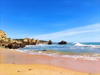 a view of the ocean from a rocky cliff at AlbufeiraOrada BlueSky by Be Cherish in Albufeira