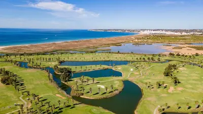 an aerial view of a golf course next to the ocean at Filomena Golf Paradise in Guia