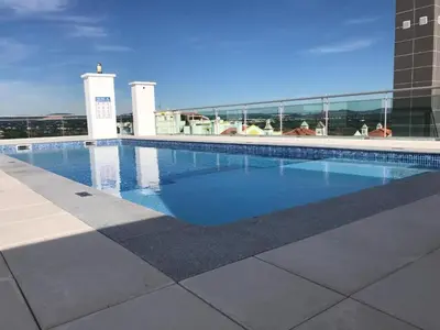 a swimming pool on top of a building at 2 Bed apartment with Roof Top Pool, close to Falesia Beach AT10 in Albufeira
