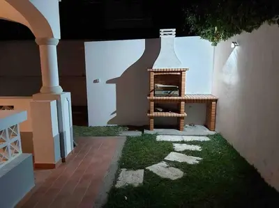 a rendering of a house with a fireplace in the yard at Villa Med - private pool, garden, sun all day, stunning views in Albufeira