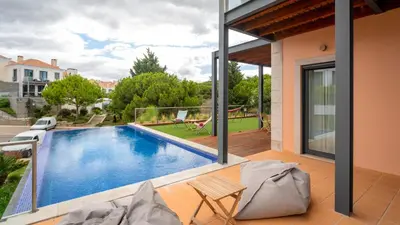 a swimming pool in the middle of a house at Apartment Luisa in Vale do Lobo