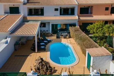 an aerial view of a house with a swimming pool at Sunny 2BDR House W/ Private Pool by LovelyStay in Albufeira