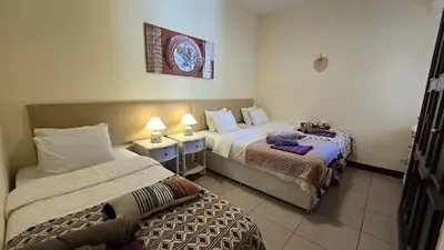 a hotel room with two beds in a room at Villa OceanKokia in Albufeira