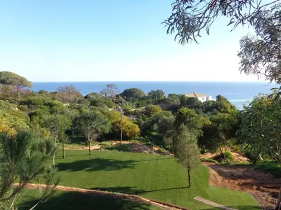 a view of a park with the ocean in the background at Bicos 101 by Check-in Portugal in Albufeira