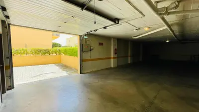 an empty garage with an open door in a building at Bicos 303 by Check-in Portugal in Albufeira