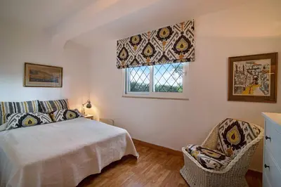 a bedroom with a bed and a window at Casa Las Trinitarias in Vale do Lobo