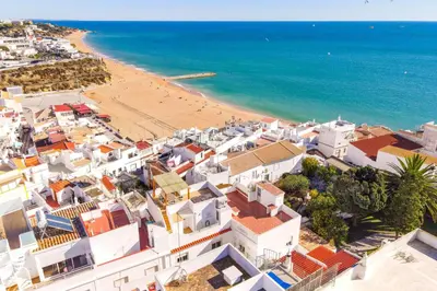 an aerial view of a town with a beach at Typical Fisherman's Cottage with amazing sea views! in Albufeira