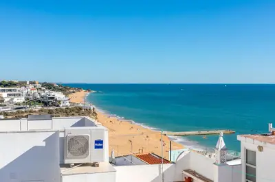 a view of the beach from the roof of a building at Typical Fisherman's Cottage with amazing sea views! in Albufeira