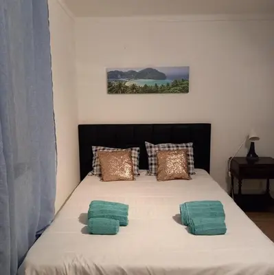 a bed with two pillows on top of it at Sunset View Apartment - 22 in Albufeira