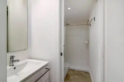 a white bathroom with a sink and a toilet at Casa Vermelha I in Faro