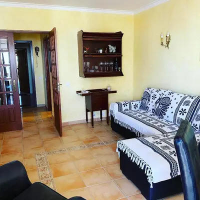 a living room with a couch and a table at Castelo I in Quarteira