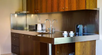 a kitchen with a stainless steel counter top at Herdade dos Salgados Beach Apartment Dalma Delux in Albufeira