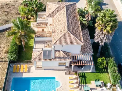 an aerial view of a house with a swimming pool at Villa Cordeiro - Heated Pool - Free wi-fi - Air Con in Guia