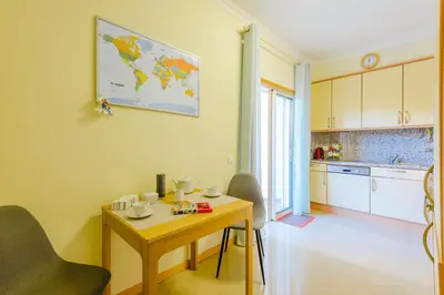 a living room with a couch and a table at BnB Homes Ocean view Apartment with huge sunny Terrace, 2 Swimming pools & Tennis court in Albufeira