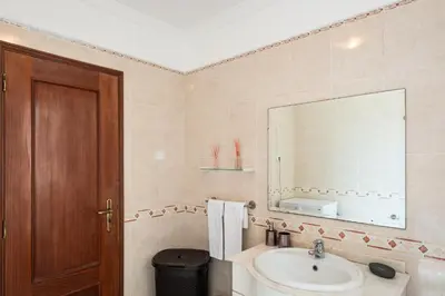 a small bedroom with a bed and a tv at #068 T1 Salgados by Home Holidays in Guia