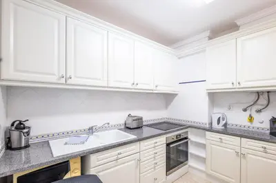 a living room with a table with fruit on it at #068 T1 Salgados by Home Holidays in Guia