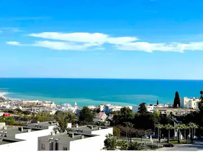 a kitchen with a sink and a counter top at Apartment Vista Mar Piscina Albufeira in Albufeira