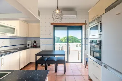 a group of wine glasses and a tray of cheese and grapes at #071 Maria Luisa by Home Holidays in Albufeira