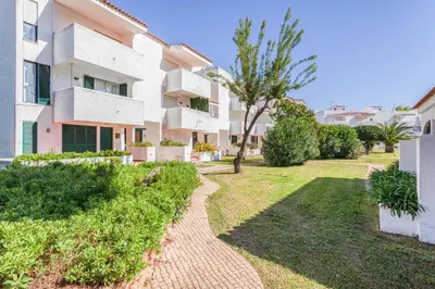 a living room with a couch and a tv at Centralgarve - Amazing Apt in the Heart of Vilamoura in Vilamoura