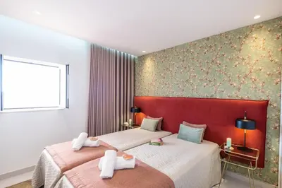 a bedroom with two beds with towels on them at Apartment Melbourne 2 by Algarve Vacation in Albufeira