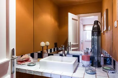 a bathroom counter with a sink and a mirror at Varandas Do Lago Villa in Almancil