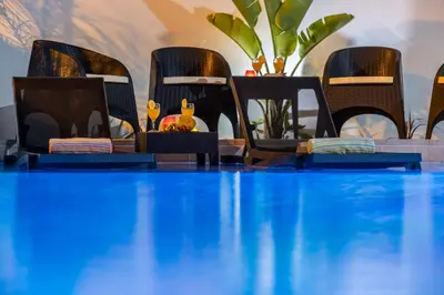 a conference room with chairs and a blue table at Villa Paradisius by Algarve Vacation in Albufeira