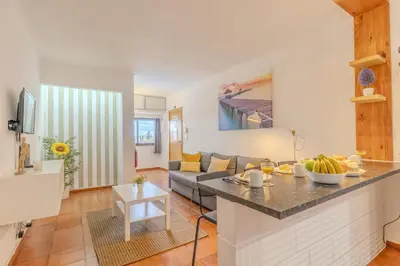 a living room with a couch and a table at #065 Zulmira Flat by Home Holidays in Albufeira
