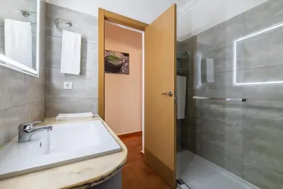 a bathroom with a shower and a sink and a toilet at #065 Zulmira Flat by Home Holidays in Albufeira