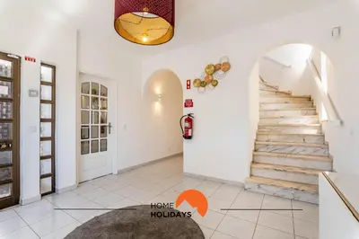 a living room with stairs in a house at #072 Casa Longa by Home Holidays in Albufeira