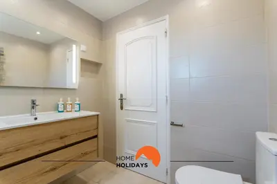 a bathroom with a shower and a toilet and a sink at #072 Casa Longa by Home Holidays in Albufeira