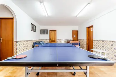 a ping pong table in a room at #072 Casa Longa by Home Holidays in Albufeira