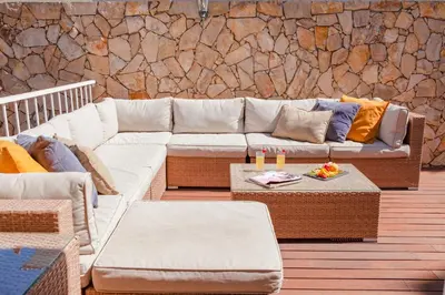 a living room with a couch and a table at Villa Dalia by Algarve Vacation in Almancil