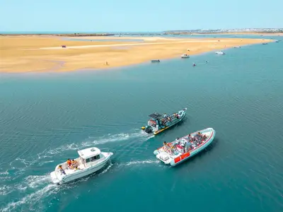 two boats in the water next to a beach at Villa Perola by Algarve Vacation in Albufeira